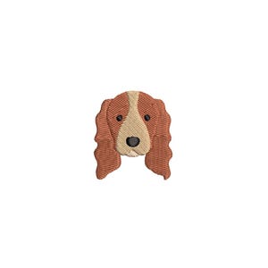 Könnte beinhalten: Gestickter Hundekopf mit braunem und beigem Fell, schwarzen Augen und einer schwarzen Nase. Die Ohren des Hundes sind lang und wellig. Das Design ist wahrscheinlich für einen Aufnäher oder eine Applikation, für Kleidung oder Accessoires.