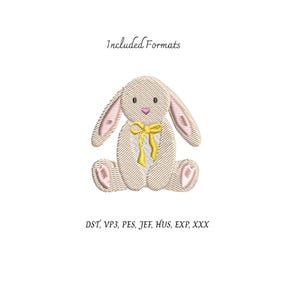 K&ouml;nnte beinhalten: Ein gesticktes Hasen-Design in Beige mit rosa Akzenten an Ohren und F&uuml;&szlig;en und einer gelben Schleife. Der Text "Included Formats" steht &uuml;ber dem Hasen, darunter Stickdateiformate: DST, VP3, PES, JEF, HUS, EXP, XXX.