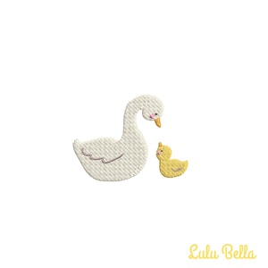 May include: A white goose with a pink beak and a yellow duckling with a pink beak. The goose is looking at the duckling.