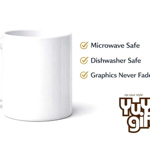 May include: A white ceramic mug with a curved handle. Text on the right side of the mug reads "Microwave Safe", "Dishwasher Safe", and "Graphics Never Fade". The mug has the logo "Yu.Ya Gift" at the bottom.