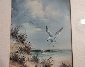 Seagull flying over beach art print , sold by Royal River Prints Inc