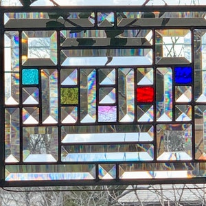 Birthstone Stained Glass with rainbow bevels  and traditional lead came window hanging to remind her of each child every day.