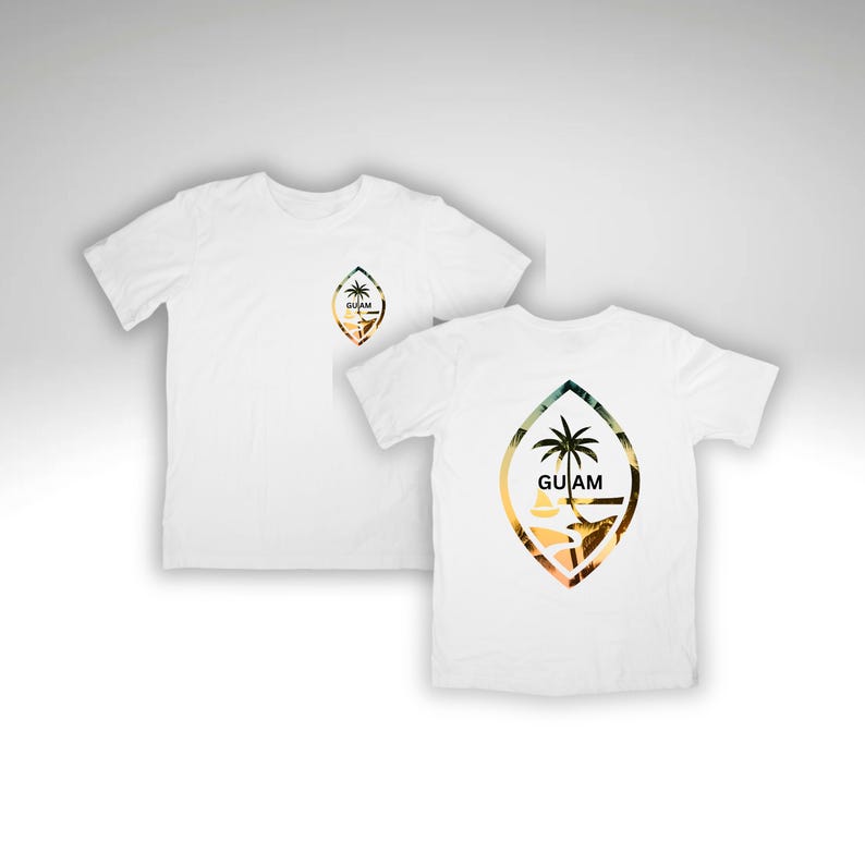 May include: Two white t-shirts with a graphic print of the Guam coat of arms. The coat of arms is a shield with a palm tree and the word "GUAM" on it. The shield is surrounded by a circle of leaves.