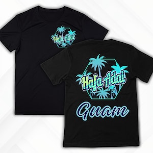 May include: Black t-shirts with a tropical design. The front of the shirt has a small design with the words "Hafa Adai" in a hexagon shape. The back of the shirt has a larger design with palm trees and the words "Hafa Adai" and "Guam".