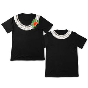 May include: Two black t-shirts. One has a white, fringed collar design and a red hibiscus flower with green leaves. The other shirt has the same white fringed collar design. Both have short sleeves and a round neckline.