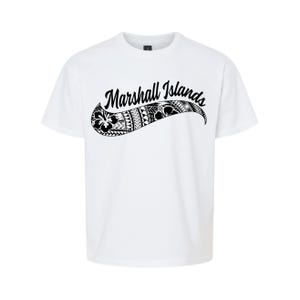 May include: White t-shirt featuring the words "Marshall Islands" in a curved, black script. The script is overlaid on a black and white tribal design. The shirt is a crew neck style.