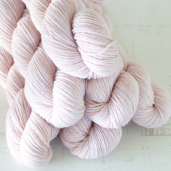100% CASHMERE yarn . Fingering Weight . 50 grams . 245 yards . Color - Shell Pink . Coastal Cashmere . Laid Back Luxury