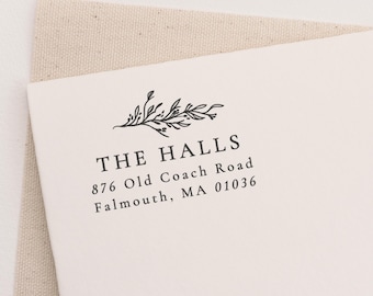 May include: A white return address label with a black floral design and the text "THE HALLS 876 Old Coach Road Falmouth, MA 01036"