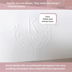 May include: White embossed wedding stationery with a monogram featuring the letter "K" and the names "JORDAN & BENNETT". The design includes a floral wreath and the text "Your initial and names here". The quote "Details are not details. They make the design."