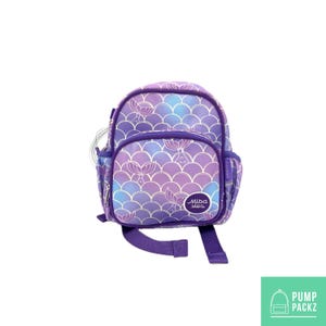 May include: A purple and blue mermaid scale-patterned backpack with a front pocket and side pocket. The backpack has a purple handle and straps. The brand name "Miba Sles" is printed on the front pocket.