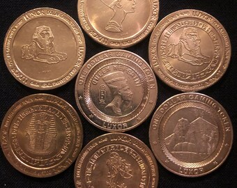 Vintage Set of (7) Luxor Casino One Dollar Tokens