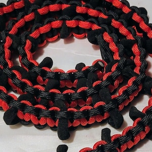 Fire Red and Black paracord DUCK WRANGLER rubber duck holder for jeeps.