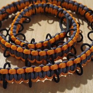 Graphite and Orange paracord Duck Wrangler rubber duck holder for jeeps.