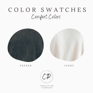 May include: Color swatches for fabric in Pepper and Ivory. The swatches are round and show the texture of the fabric. The text "Comfort Colors" is above the swatches. The Chelle Ro Co logo is below the swatches.