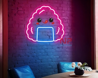 May include: A neon sign in the shape of a smiling onigiri, a Japanese rice ball, with a pink outline and blue accents. The sign is mounted on a brick wall with a pink and blue gradient. The sign has the text "NEONCRIME".