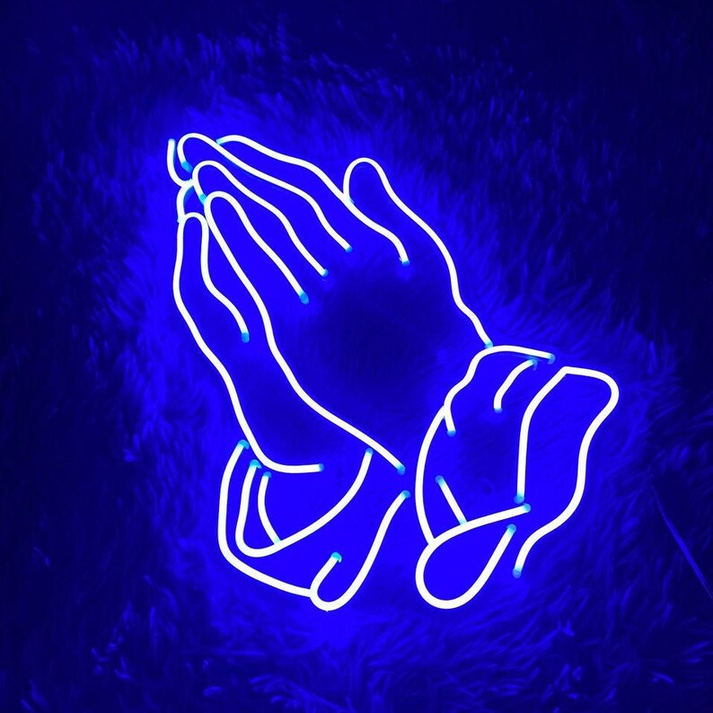 May include: A neon blue sign in the shape of two hands clasped together in prayer.