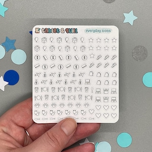 Puede incluir: Una hoja de pegatinas con el texto "tablet & quill" y "everyday icons". La hoja contiene pequeñas ilustraciones en blanco y negro de varios objetos, incluyendo regalos, estrellas, dinero, zapatos, aviones, ordenadores portátiles, tazas de café y corazones.