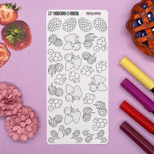 May include: A sheet of white sticker paper with black and white illustrations of berries and strawberries. The sticker sheet is labeled "Tablet & Quill" and "Berry Patch".