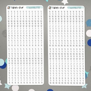 Op de afbeelding: Twee witte stickerbladen met zwarte cijfers en de tekst "Tablet & Quill" en "Schedule Strips". De stickers zijn voor planning en organisatie. De cijfers variëren van 1 tot en met 12.