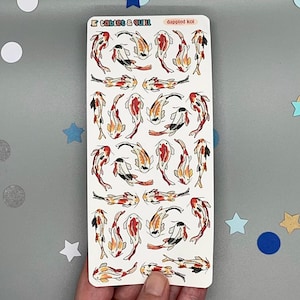 May include: A sheet of 24 stickers featuring colourful koi fish illustrations. The stickers are printed on white paper and have a glossy finish. The sheet is labelled "Dappled Koi" and "Tablet & Quill".