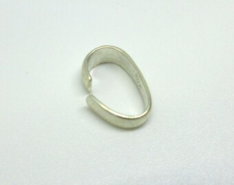 May include: Silver-toned metal clasp for a necklace or bracelet. The clasp is oval-shaped and has a smooth, polished finish.