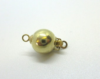 May include: Gold-toned ball clasp with a spring-loaded closure. The clasp is designed to be used for necklaces or bracelets.