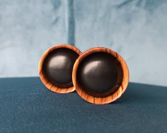 Wooden plugs made out of Olive wood with Eben inlay.