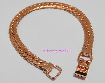 May include: A rose gold bracelet with a flat, woven chain design. The bracelet features a rectangular clasp and a matching loop for secure closure. The text "SilverjewelGB" is visible in the image.