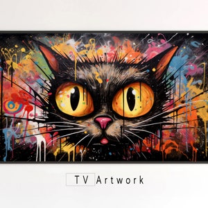 以下が含まれることがあります： 大きな黄色い目をした猫の顔を描いたカラフルな抽象画。背景は黒、赤、黄、青、緑の塗料の飛沫が混ざり合ったものになっている。