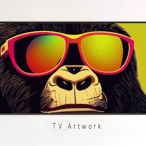 May include: A close-up of a gorilla's face wearing pink and red sunglasses with a yellow and green gradient lens. The gorilla's fur is black and the background is yellow.