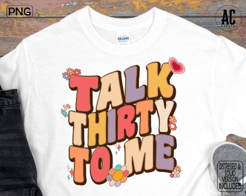 May include: White t-shirt with a retro-style graphic that says "Talk Thirty To Me" in colorful, outlined letters. The graphic also includes flowers and a heart.