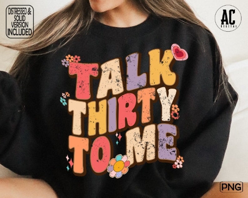 May include: A black sweatshirt with a colorful graphic design that says "Talk Thirty To Me" with flowers and hearts.
