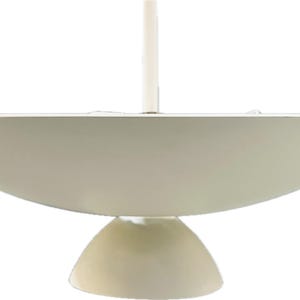 May include: A white, saucer-shaped pendant light fixture with a round, white base.