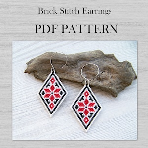 May include: A pair of red, white and black beaded earrings with a diamond shape and a floral design. The earrings are hanging from silver hooks. The text "Brick Stitch Earrings PDF PATTERN" is displayed above the earrings.