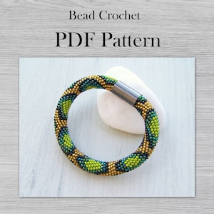 May include: A green, gold, and black beaded bracelet with a magnetic clasp. The bracelet is on a white background. Bead Crochet PDF Pattern.