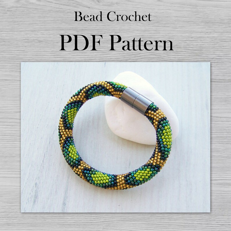 May include: A green, gold, and black beaded bracelet with a magnetic clasp. The bracelet is on a white background. Bead Crochet PDF Pattern.