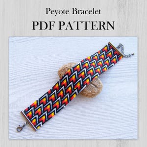 May include: A colorful Peyote bracelet with a geometric pattern in black, white, yellow, orange, and red. The bracelet is displayed on a small, textured rock. The image includes the text "Peyote Bracelet PDF PATTERN".
