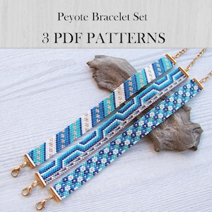 May include: Three peyote stitch bracelets featuring geometric patterns in shades of blue, white, and metallic gold. Each bracelet has gold-toned metal end caps and lobster claw clasps. The text "Peyote Bracelet Set 3 PDF PATTERNS" is visible.