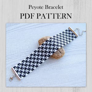 May include: Black and white peyote stitch bracelet with a silver clasp. PDF pattern for making the bracelet. Peyote Bracelet PDF PATTERN.