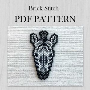 May include: Black and white beaded giraffe head pattern in brick stitch. PDF pattern.