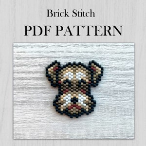 May include: A brown and black brick stitch bead pattern of a dog's face. The pattern is for a small dog with brown, black, white, and red beads. The pattern is titled "Brick Stitch PDF PATTERN".