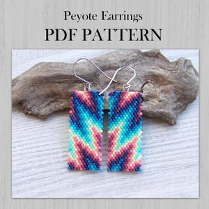 May include: A pair of rectangular peyote stitch earrings featuring a vibrant zigzag pattern in shades of pink, blue, and yellow. The earrings are suspended from silver-toned metal hooks. The text Peyote Earrings PDF PATTERN is visible.