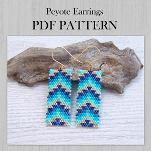 May include: Two beaded Peyote earrings with gold-colored hooks. The earrings feature a geometric pattern in shades of blue, teal, and gold. The text "Peyote Earrings PDF PATTERN" is at the top of the image.