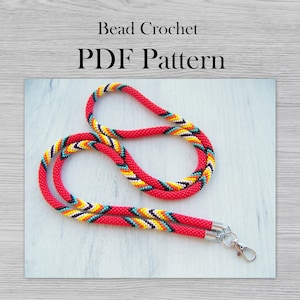 May include: A red beaded lanyard with a colorful geometric pattern in yellow, black, turquoise, and white. The lanyard has a silver clasp and the text "Bead Crochet PDF Pattern" at the top.