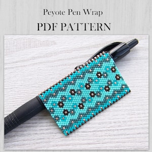 May include: A black ballpoint pen featuring a peyote stitch bead wrap with a geometric pattern in shades of turquoise, teal, and dark brown. The text Peyote Pen Wrap PDF PATTERN is displayed above the pen on a light wood grain background.