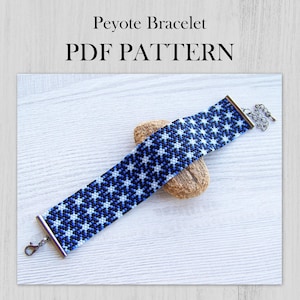 May include: A blue and white beaded peyote bracelet with a star pattern. The bracelet is displayed on a small, tan stone. The text "Peyote Bracelet PDF PATTERN" is at the top of the image.