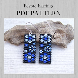 May include: Rectangular peyote earrings with a floral pattern in shades of blue and white on a black background. The earrings are displayed on a piece of driftwood. The text "Peyote Earrings PDF PATTERN" is at the top.