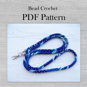 May include: A blue and light blue beaded lanyard with a silver clasp. Bead Crochet PDF Pattern.