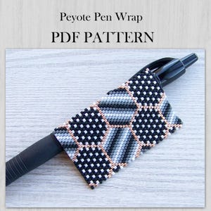 May include: A Peyote Pen Wrap PDF PATTERN featuring a geometric beadwork design in black, white, and gray seed beads with metallic copper accents. The wrap is shown fitted around a black ballpoint pen, displaying a repeating grid pattern.