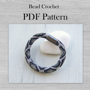 May include: A black and silver beaded bracelet with a magnetic clasp. Bead Crochet PDF Pattern.